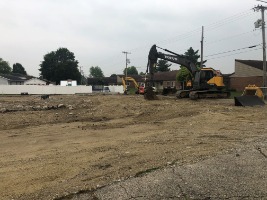Bulldozer and leveled dirt lot